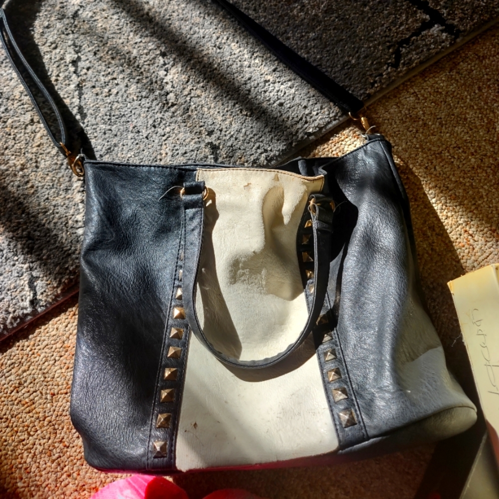 Studded black and white purse